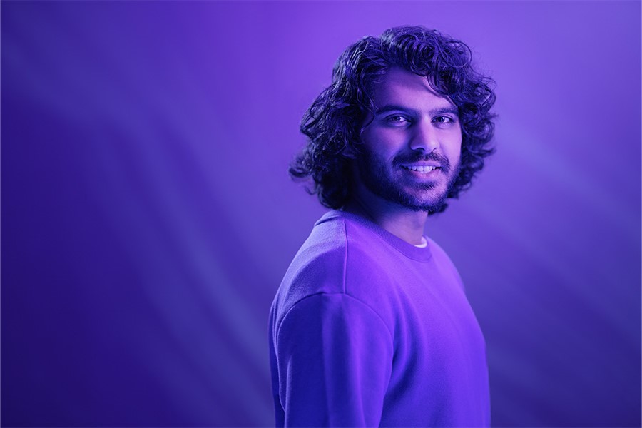 A person smiles at the camera.