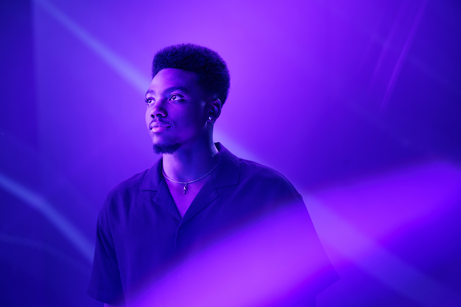 A person in purple lighting.